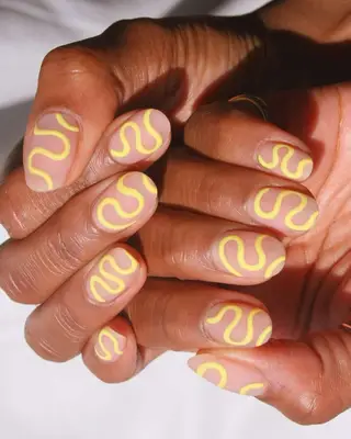 Yellow squiggle matte nails