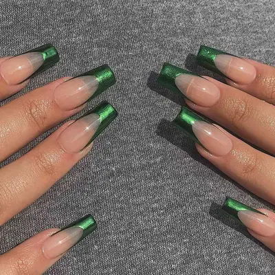 close up of hand showing off fresh manicure, green chrome french tips