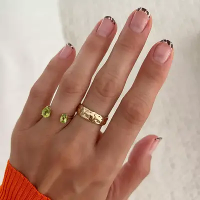 nude nails with cow printed micro tips