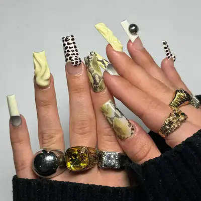 Butter yellow 3D snake skin manicure