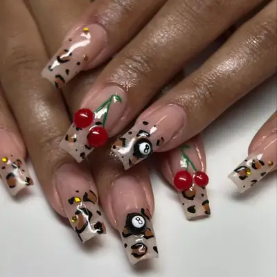 Cheetah print french tips with cherries and 8 balls
