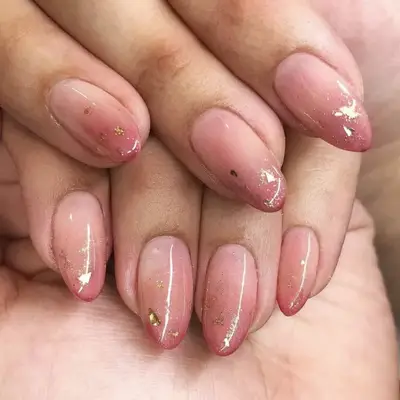Ombré rose-toned nude nails with gold glitter