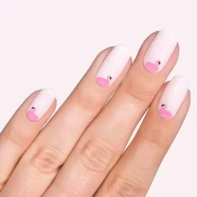 Pale pink nails with flamingo design in center cuticle