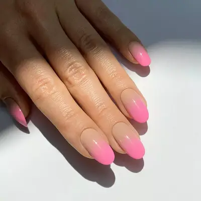 Neutral nails with hot pink ombré design