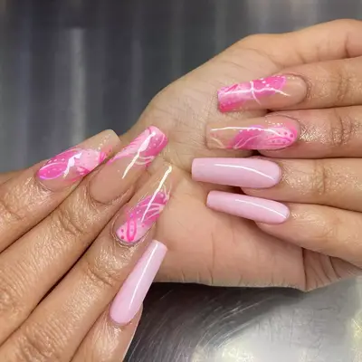 Baby pink and neutral nails with old school-inspired abstract nail design