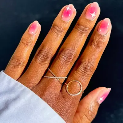 Blush pink nails with white twinkle star design