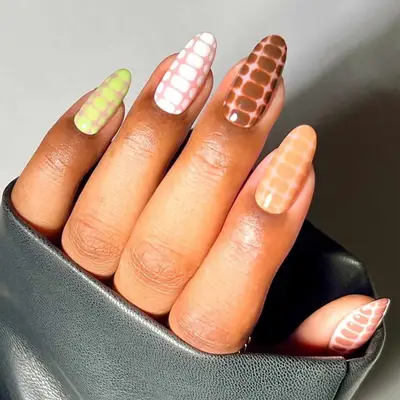 A croc manicure with shades in iced coffee hues