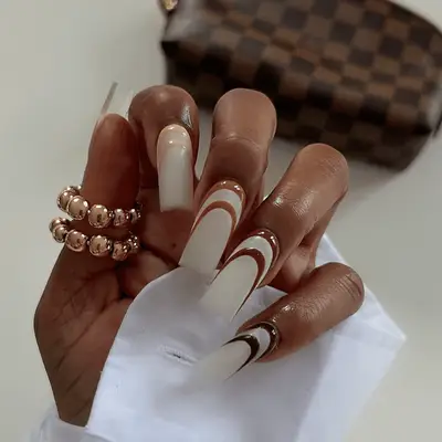 Close up of a coffee manicure with mocha swirls