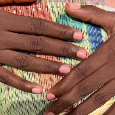 Close up of nude nail with a thin French tip.