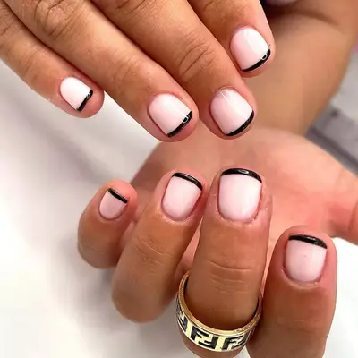 Baby French manicure with half-baby blue, half-bubblegum pink tips