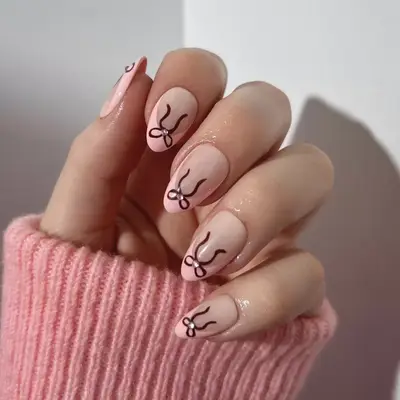 pink French manicure with ribbons