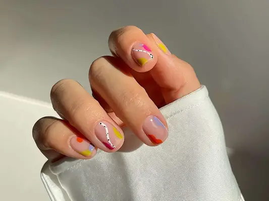 A short manicure with fun abstract designs