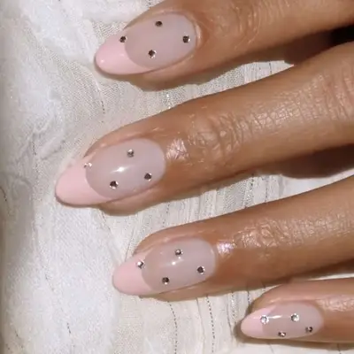 pale pink french manicure with rhinestones