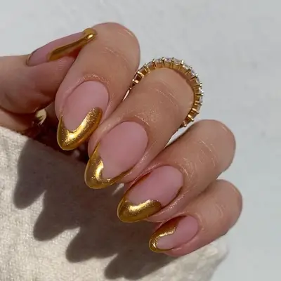matte manicure with gold chrome accent 