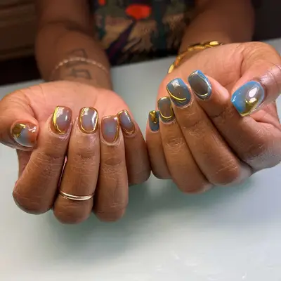 Gold accent chrome manicure