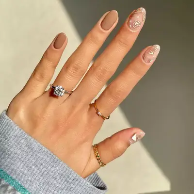 manicure with khaki nails and Nude Heart details