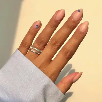 clear nails with tiny Evil Eyes