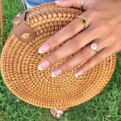 Pale clear nails with small gold hearts on each