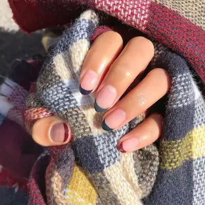 Jewel-toned tip nails with clear base