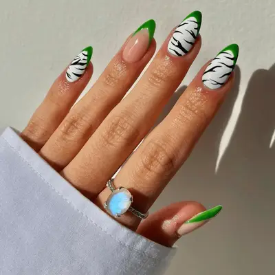 Zebra nails with green French tips