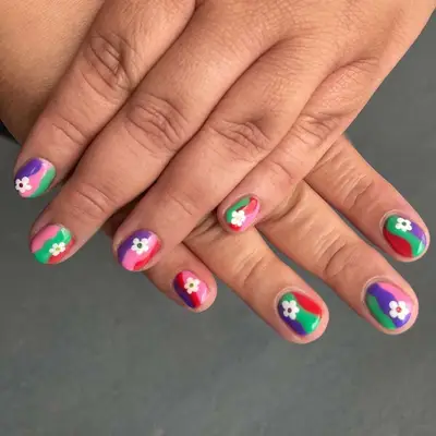 multicolor short nails with white flower designs