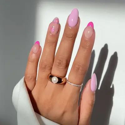 Manicure with a mixture of a French manicure design and solid light pink polish 