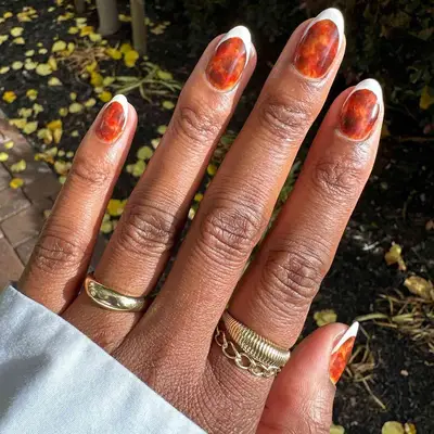 French manicure with shiny tortoiseshell base and matte white tips