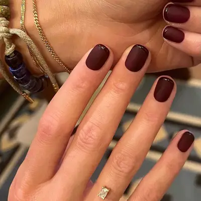 Monochrome burgundy French manicure with matte base and glossy tips