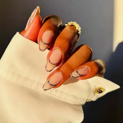 Neutral manicure with glitter double French tips