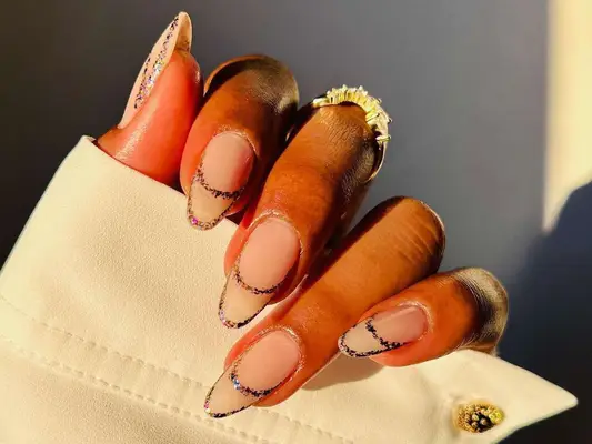 Manicure with glossy neutral base and glitter double French tip