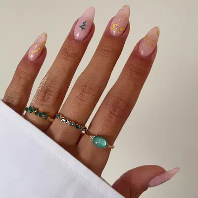 nude nails with gold foil accent and christmas tree