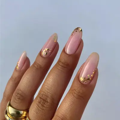 Gold foil on pink nails