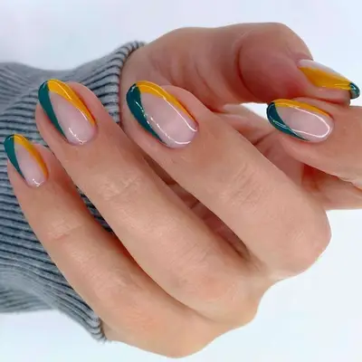 A v-shape French manicure with blue and yellow tips