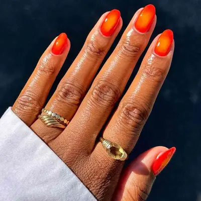 An orange aura manicure 