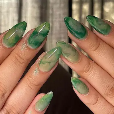 A green marble/watercolor manicure