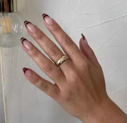 Sliced French manicure with burgundy tips