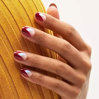 A burgundy manicure with subtle lilac accents