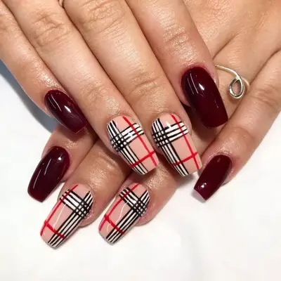 Burberry-print nails with burgundy accent nails