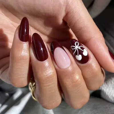 a short burgundy manicure 