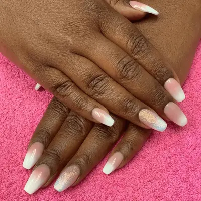 Pink and white French ombre manicure with silver glitter accent nails