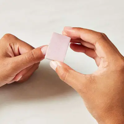 Close up of a thumb nail being buffed