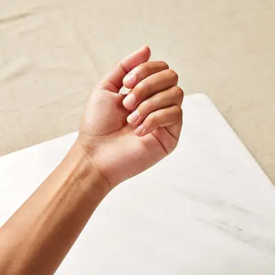 Close up of a hand of filed nails