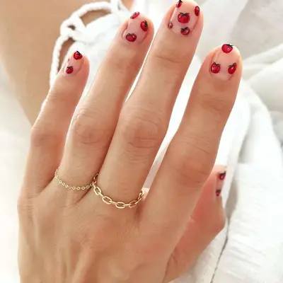 Literal tomato red nails with tiny tomato nail art