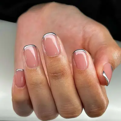 A micro French manicure with silver chrome tips