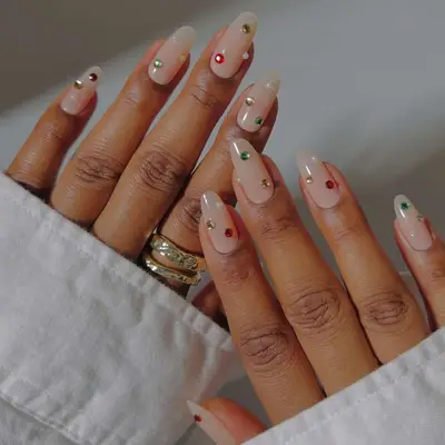 A sheer, natural manicure with gemstone accents