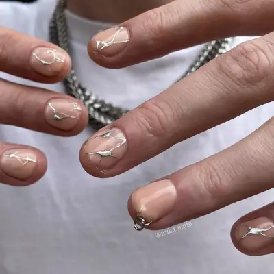 abstract silver nails with piercing