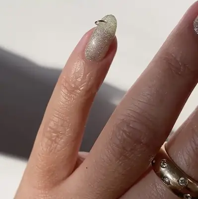 sparkly nails with piercing on pinky