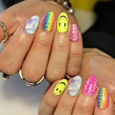 a mismatched manicure with tie dye nails