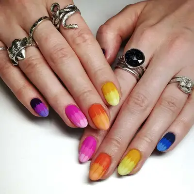A matte tie-dye manicure in gradient colors