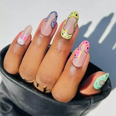 colorful speckled Easter nails with bunny nail art